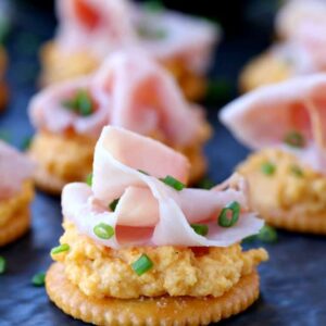 Ham and Pub Cheese Crackers close up on slate