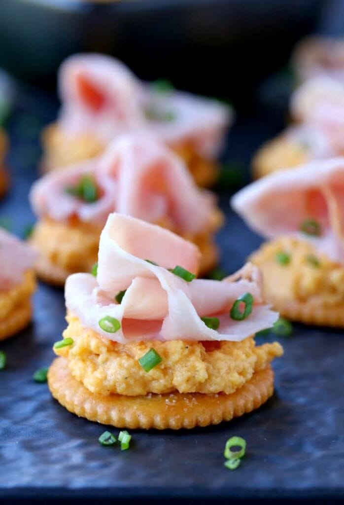 Ham and Pub Cheese Crackers close up on slate