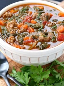 Low Carb Sausage Vegetable Soup in a bowl close up with parsley