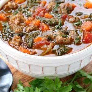 Low Carb Sausage Vegetable Soup in a bowl close up with parsley