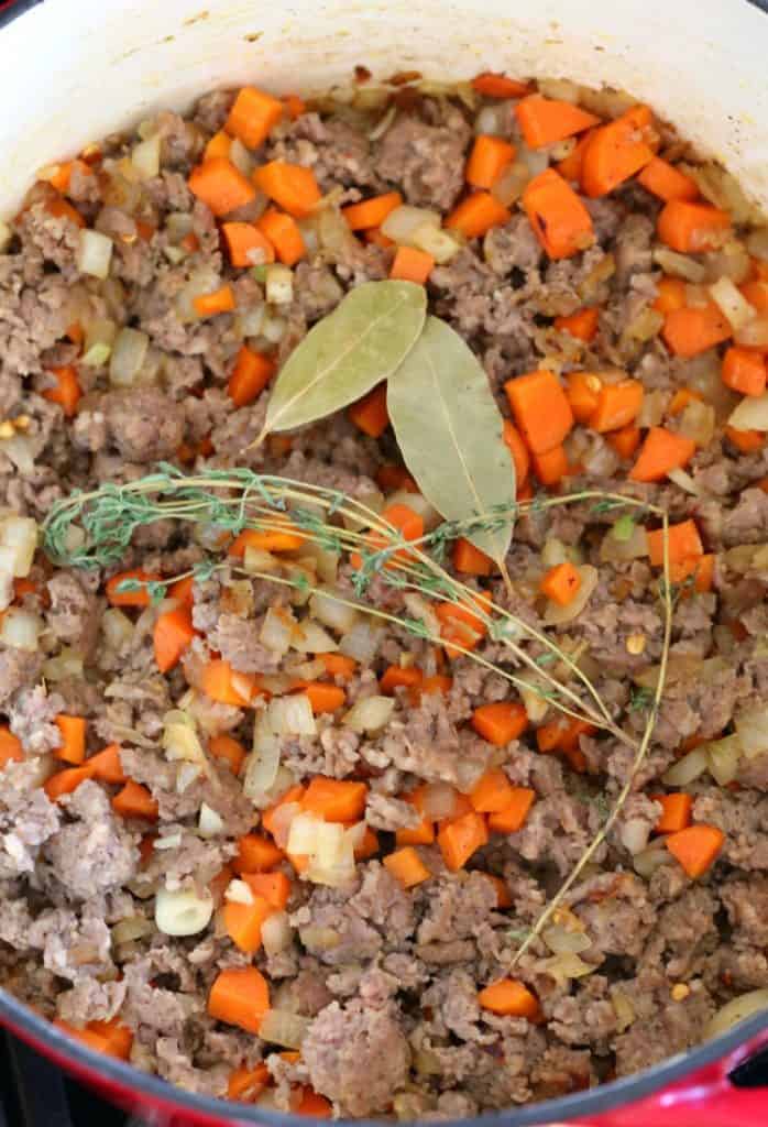 process photo of sausage and vegetables in sup shot to make low carb soup recipe