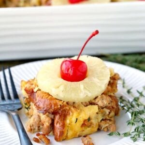 Slice pof pineapple and sausage stuffing on a plate