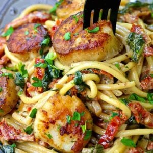 Creamy Tuscan Spaghetti with Jumbo Scallops is a scallop recipe with pasta in a creamy sauce with spinach