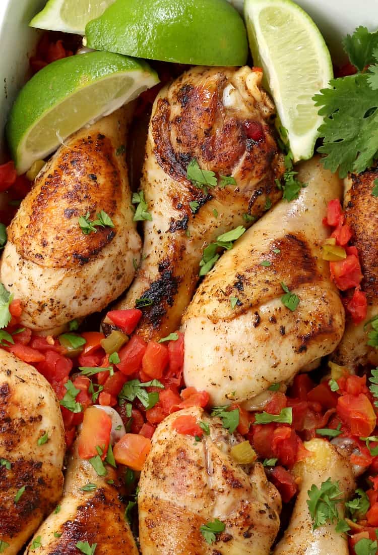 Oven Baked Fiesta Chicken Legs with fresh limes