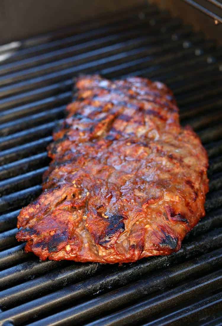 Dan's Famous Whiskey Steak on the grill cooking