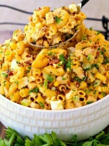 Devilish Buffalo Chicken Pasta Salad in a white bowl with a spoon