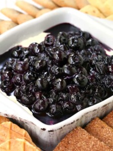No Bake Blueberry Cheesecake Dip in a dish with cookies