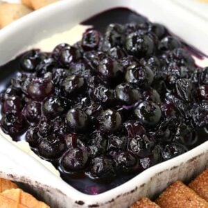 No Bake Blueberry Cheesecake Dip in a dish with cookies