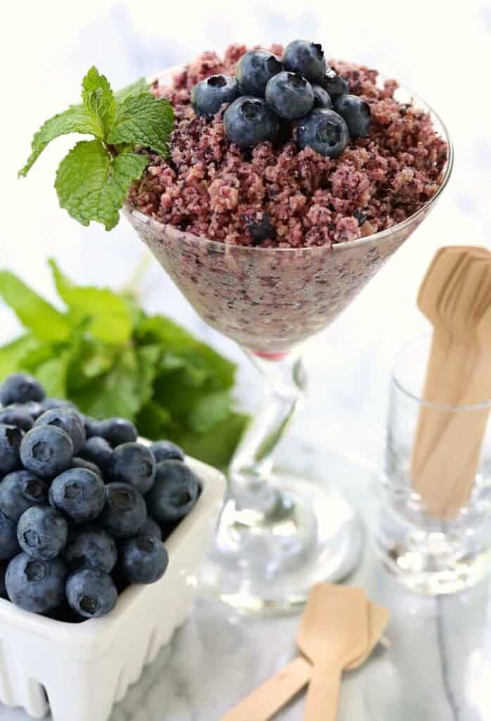RumChata Fresh Blueberry Granita with mint and blueberries in a glass