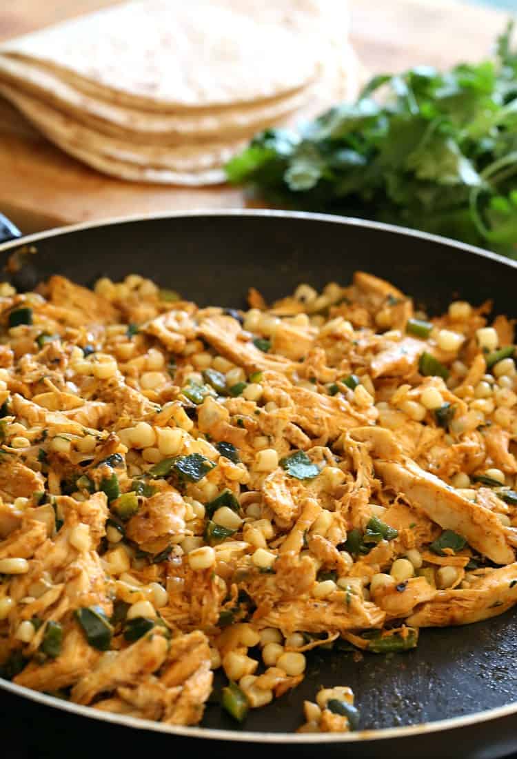 filling in skillet for chicken enchiladas