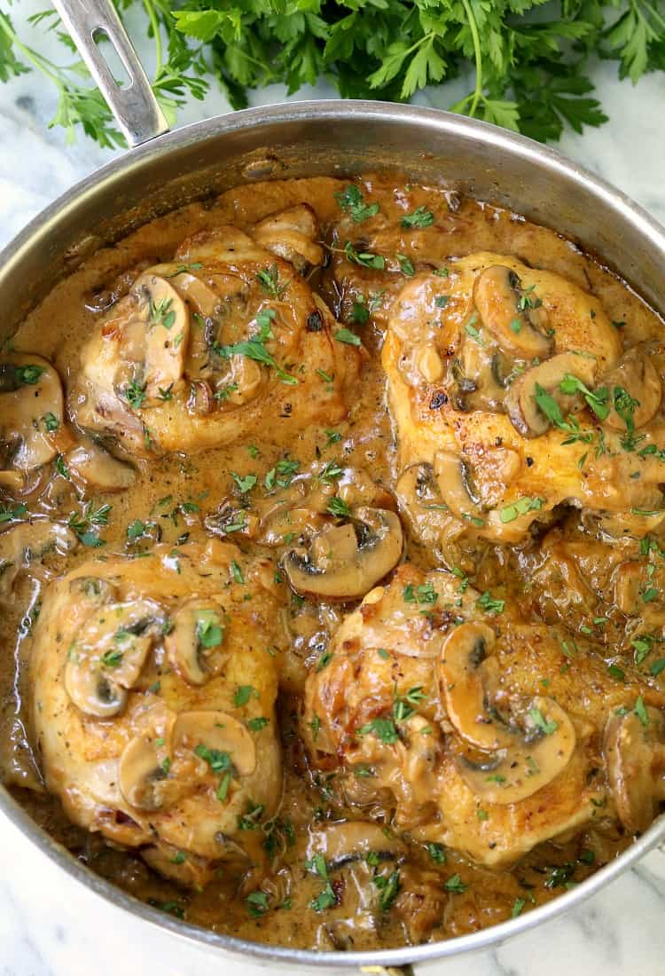Caramelized Onion Chicken Thighs in a skillet with parsley