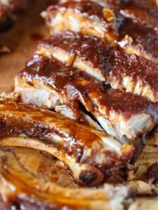 BBQ ribs sliced on a board