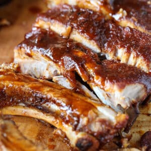 BBQ ribs sliced on a board