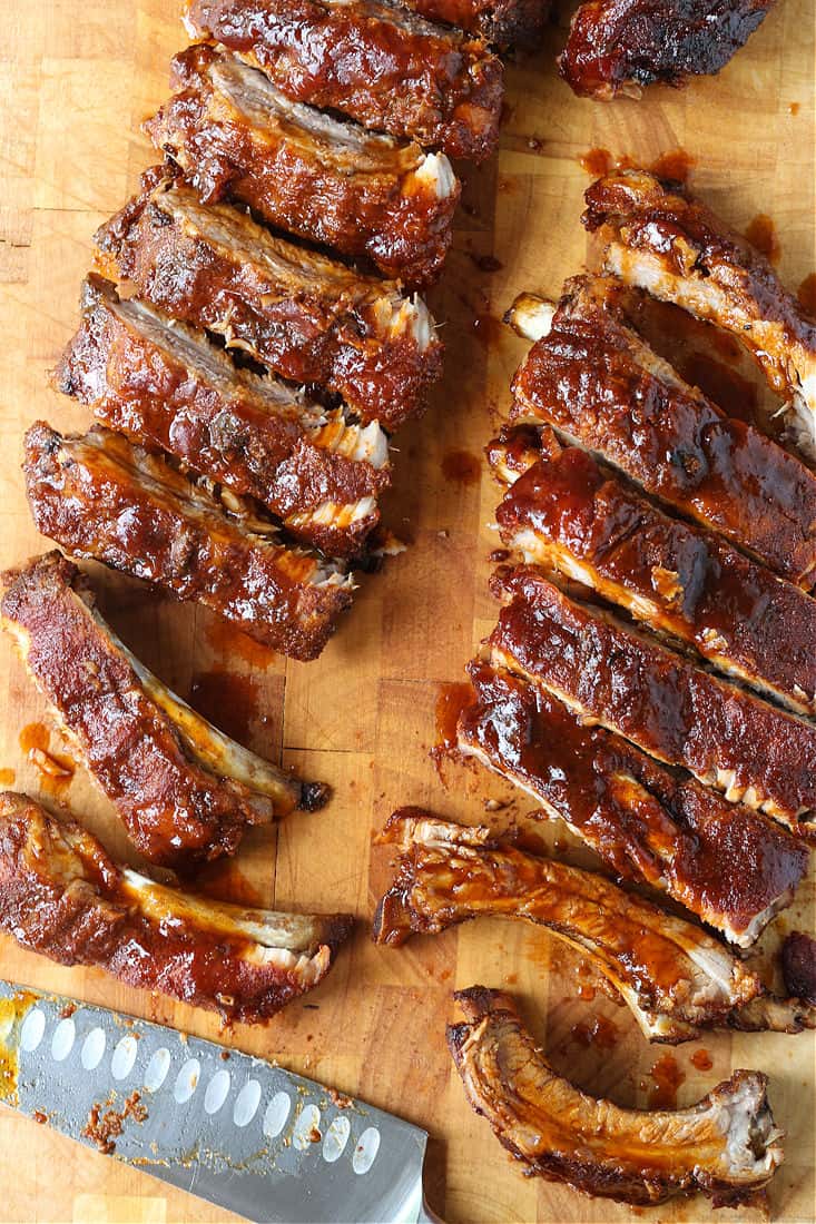 Barbecue ribs cut on a board with a knife