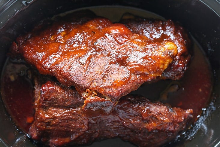 Cooked barbecue ribs in a crock pot