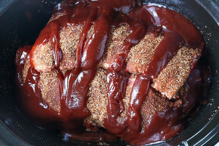 barbecue sauce on ribs in a slow cooker