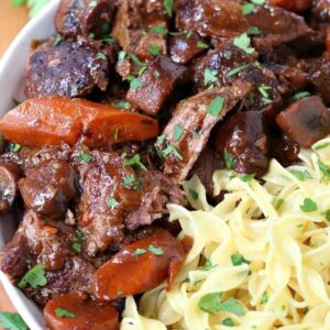 French Bistro Beef Stew in a bowl with noodles and vegetables
