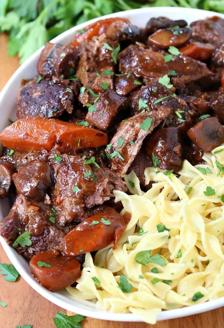 French Bistro Beef Stew in a bowl with noodles and vegetables