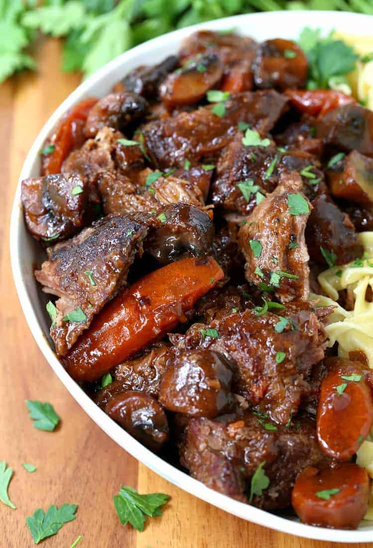 French Bistro Beef Stew in a bowl with noodles close up