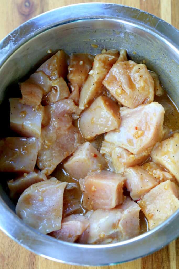 pieces of chicken marinating in bowl