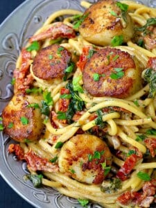 Creamy Tuscan Spaghetti with Jumbo Scallops is a scallop and spaghetti recipe in a creamy 15 minute sauce