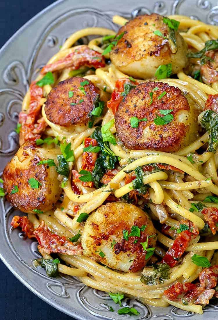 Creamy Tuscan Spaghetti with Jumbo Scallops is a pasta recipe with seared jumbo scallops