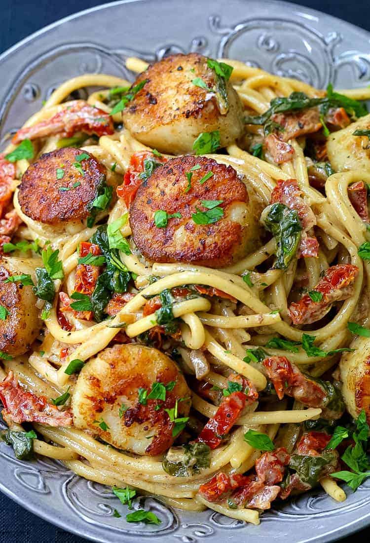 Creamy Tuscan Spaghetti with Jumbo Scallops is a scallop and spaghetti recipe with a creamy sauce