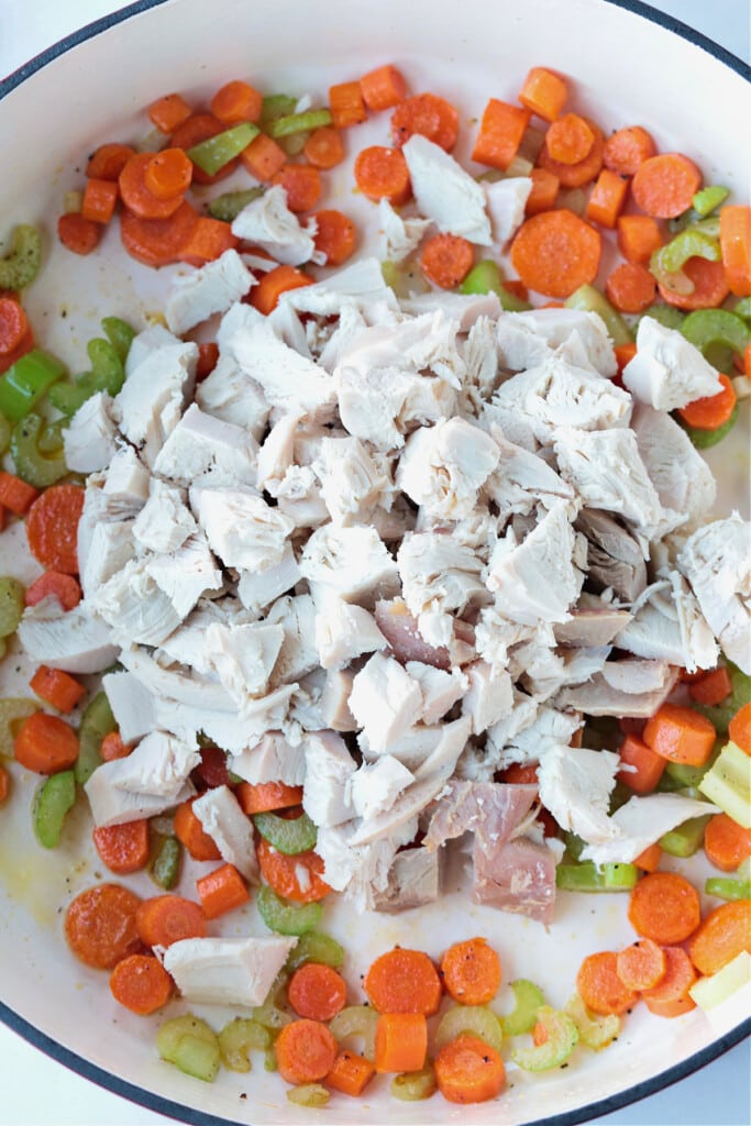 vegetables and leftover turkey in a pot to make turkey soup