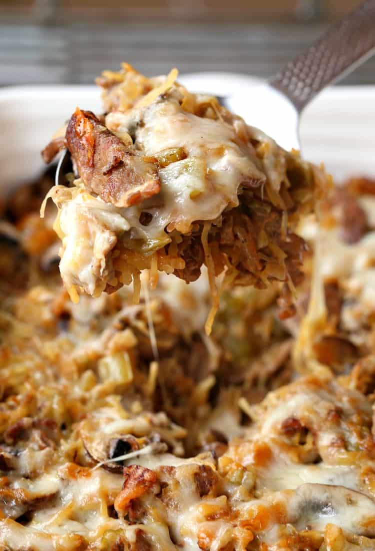 Philly Cheesesteak Spaghetti Squash Casserole is a low carb casserole recipe with shaved beef, peppers, cheese and squash instead of pasta