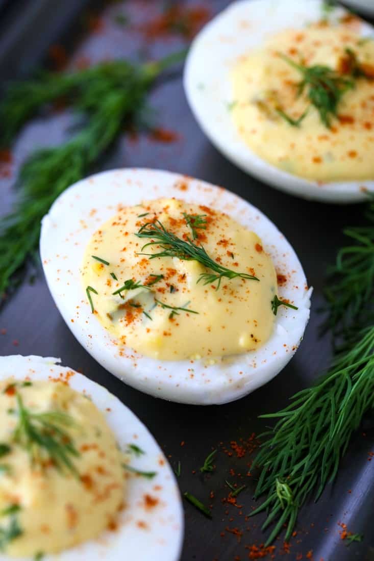 This Classic Deviled Eggs Recipe shows deviled eggs on a platter with fresh dill