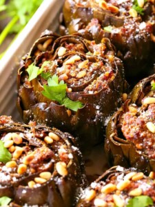 Grandma's Best Stuffed Artichokes are a side dish stuffed with sausage, cheese and pine nuts