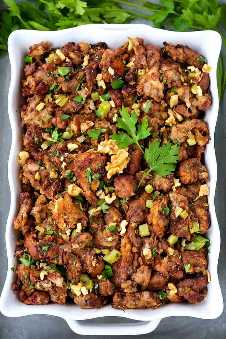 This Waldorf Stuffing recipe is sweet, savory and insanely delicious! A unique stuffing made with chicken sausage, walnuts and raisin bread! Waldorf Chicken Sausage Stuffing Recipe in baking dish