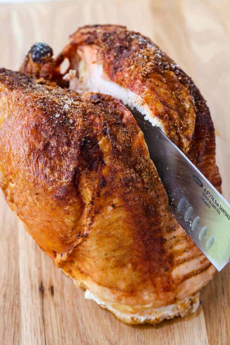 How To Cook And Carve A Turkey Breast cutting into a turkey breast