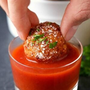 Pepperoni Pizza Arancini is a rice ball appetizer recipe served with marinara sauce