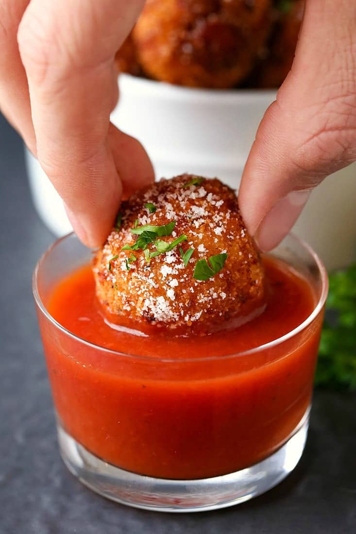 Pepperoni Pizza Arancini is a rice ball appetizer recipe served with marinara sauce