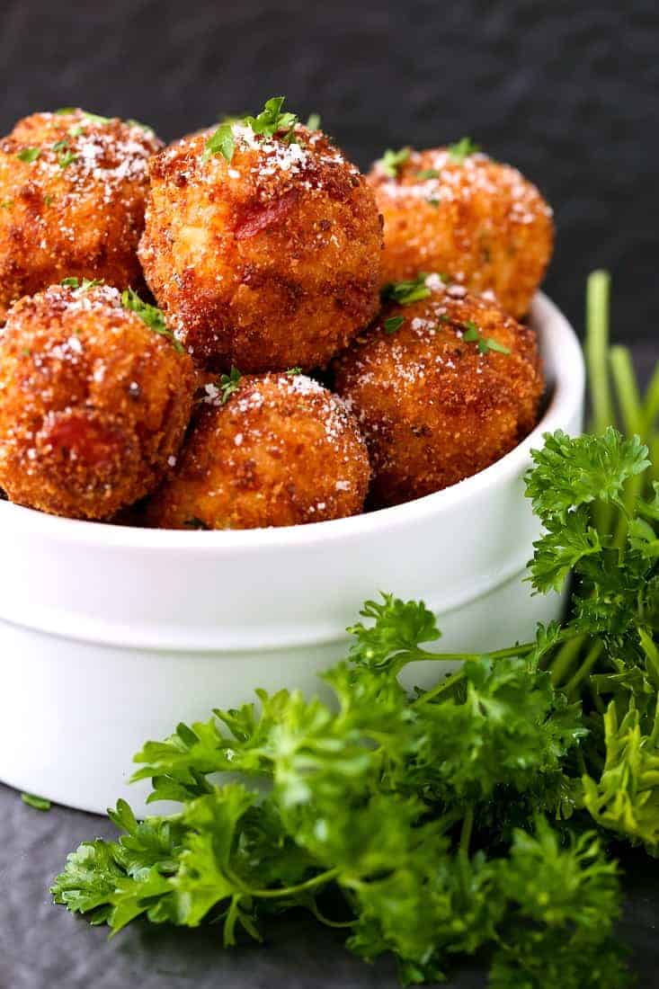 Pepperoni Pizza Arancini is an appetizer recipe that's fried with pepperoni and cheese