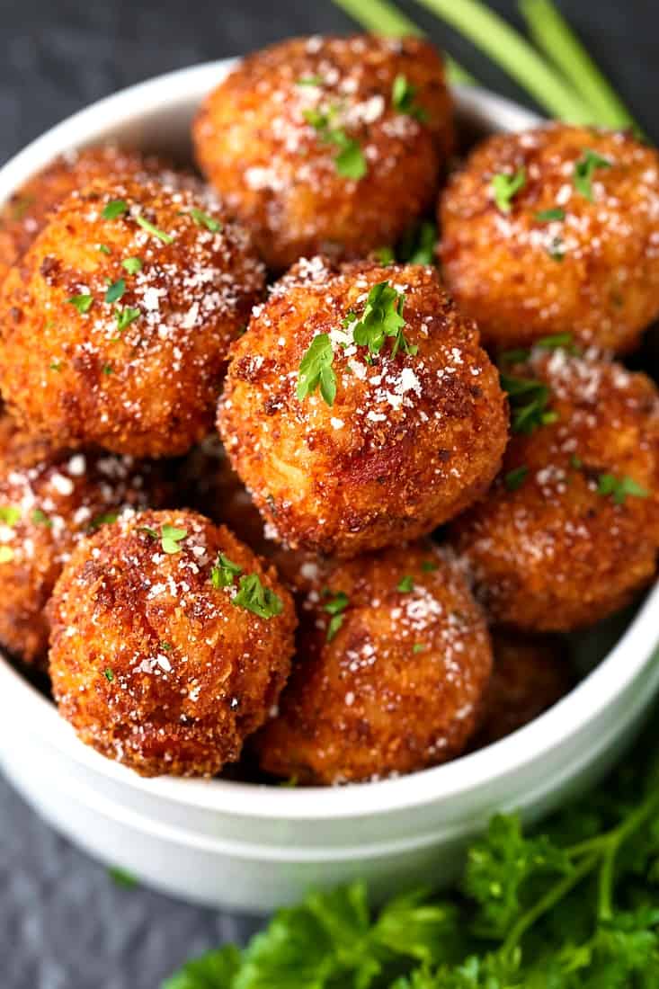 Pepperoni Pizza Arancini are an appetizer recipe that's served with marinara sauce for dipping