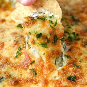 Spinach Artichoke Dip is a baked spinach dip with three kinds of cheese