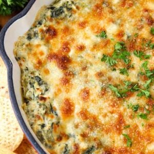 Spinach Artichoke Dip is a hot dip recipe topped with cheese and baked