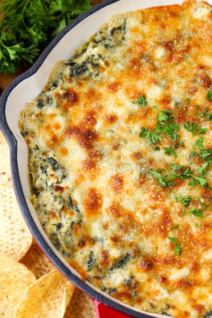 Spinach Artichoke Dip is a hot dip recipe topped with cheese and baked
