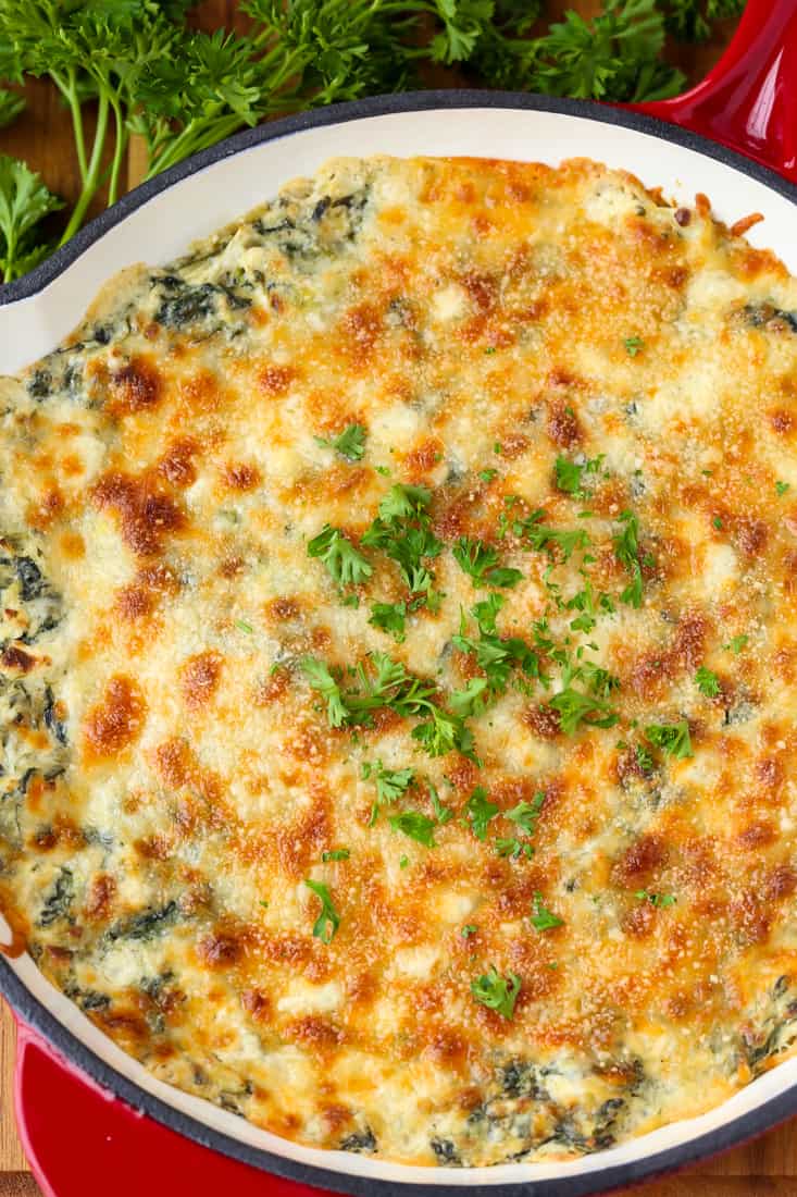 Spinach Artichoke Dip is a hot spinach dip recipe topped with cheese