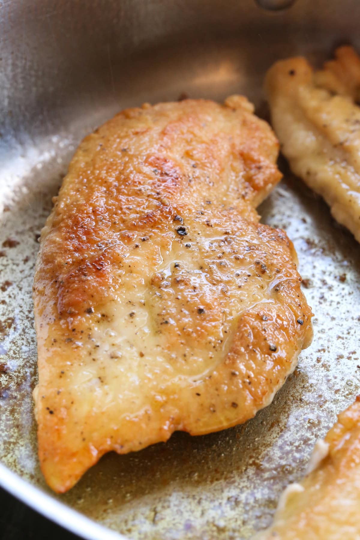 seared chicken breast in a skillet