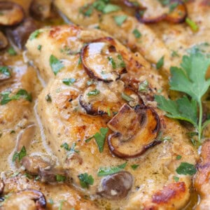 chicken marsala in a skillet with parsley