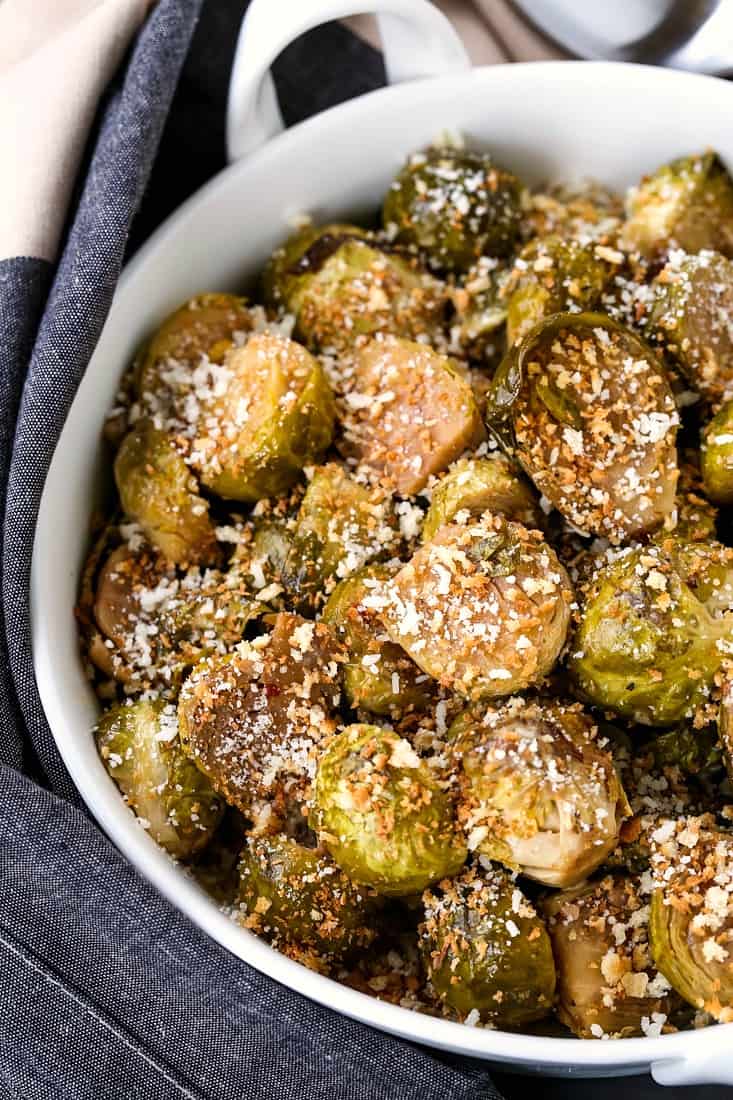 A brussels sprouts recipe that is coated with parmesan cheese and breadcrumbs