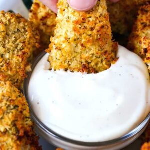 chicken nugget being dipped into ranch dressing