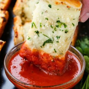 Easy Cheesy Garlic Bread is a cheese topped garlic bread that can be dipped in marinara sauce