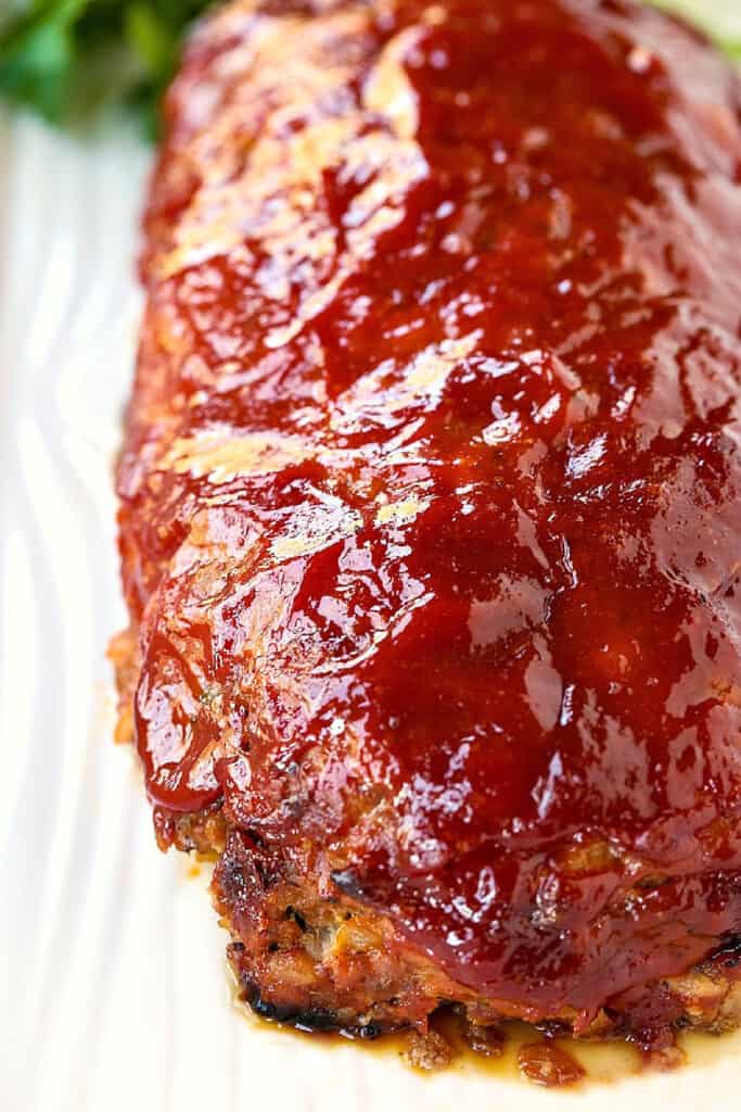 cooked, glazed meatloaf on baking sheet
