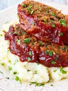 meatloaf slices on top of mashed potatoes