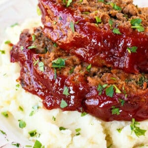 meatloaf slices on top of mashed potatoes