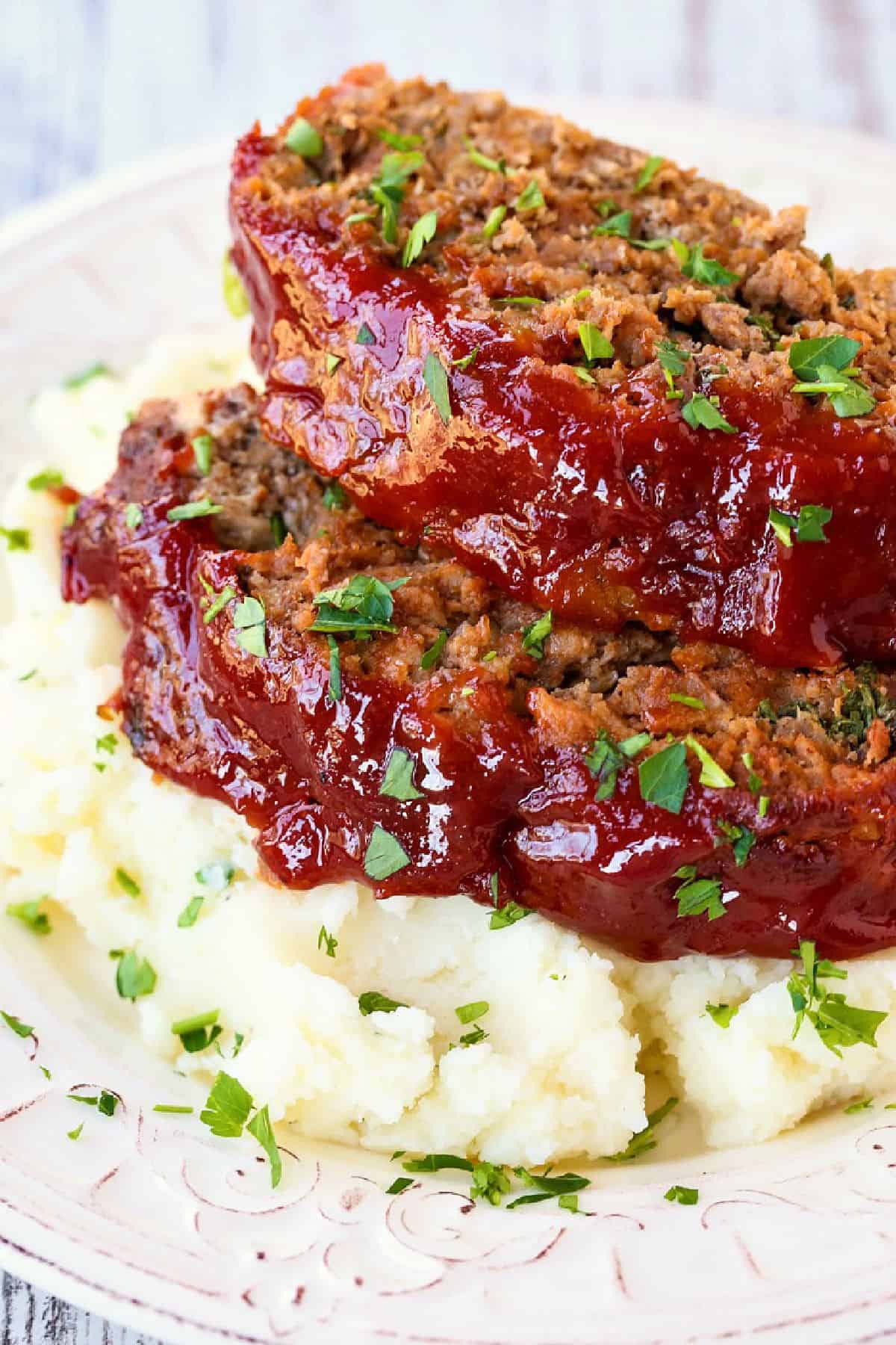 meatloaf slices on top of mashed potatoes